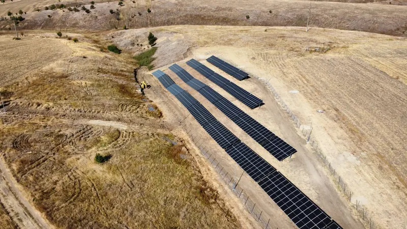 Solar arrays on a hillside site