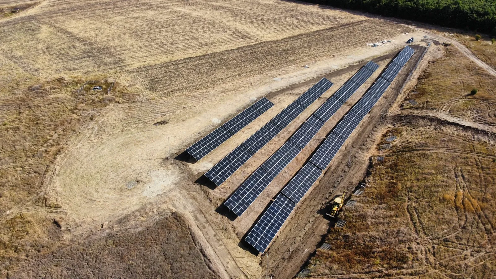 Rows of solar panels running down the hillside